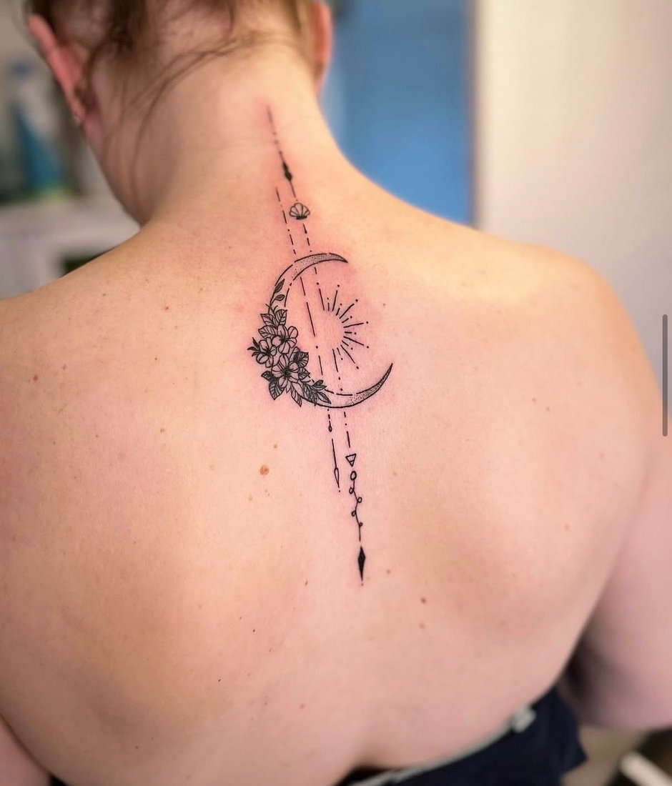 Crescent moon and florals tattoo on the nape
